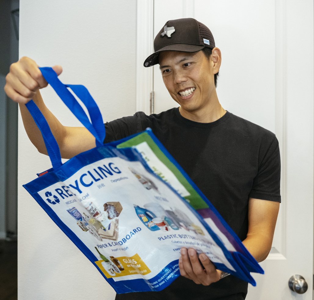 man-holding-recycling-tote